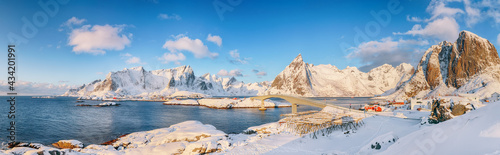 Panoramic winter view on Reine, Sakrisoya and Hamnoy villages and bridge to Olenilsoya island .