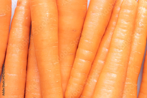 Fresh orange carrots, close-up view, group photo