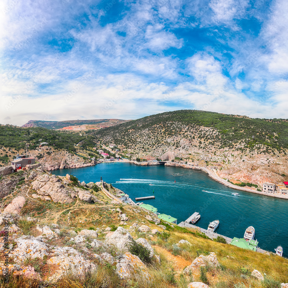 Scenic view of Balaklava bay with yachts and ruines of Genoese fortress Chembalo in Sevastopol city from the height