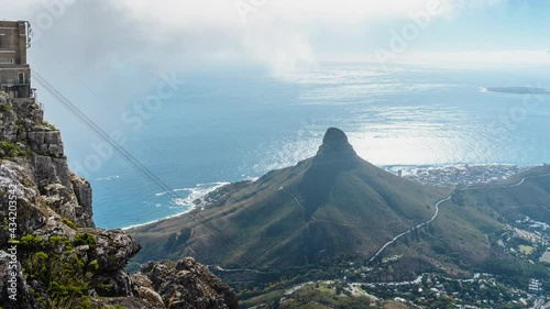 Zoom out timelapse view of natural landmark Lions Head and Table Mountain cableway in Cape Town, South Africa. 
