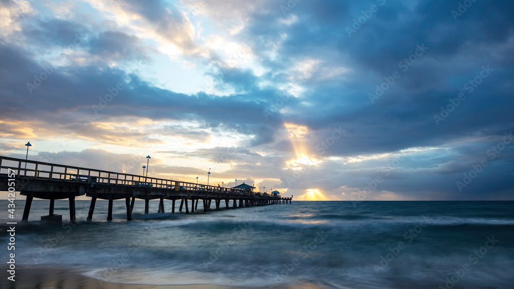 Pompano Beach Pier Broward County Florida stormy weather and sunrise