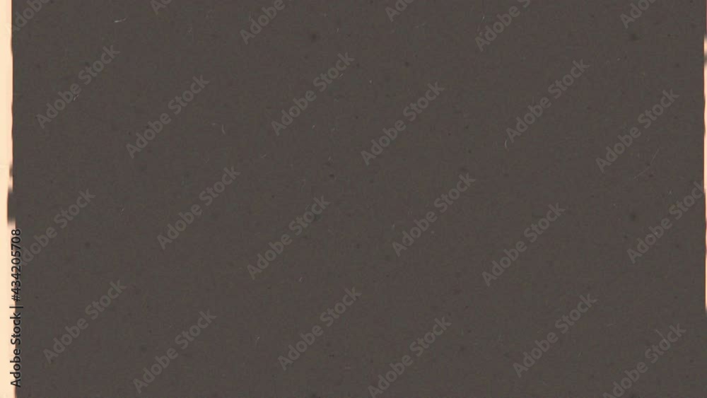 Sepia Film noise or grain seamless texture. Retro template. Opacity overlay mode usage for overlay your video. Negative film. Scratched strip. Old fashion tape looped animation in 4K. Vintage effect