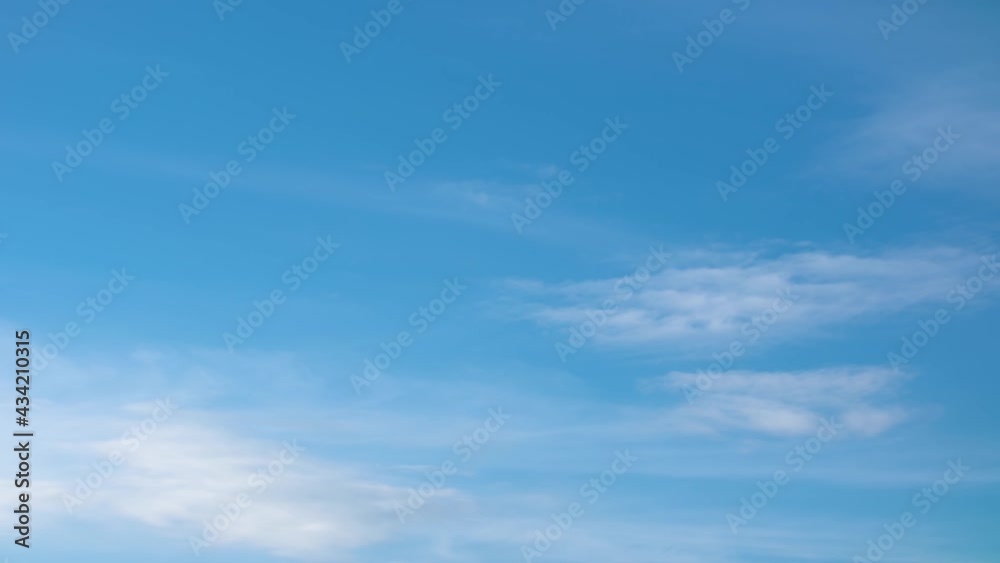 Light white clouds moving fast in time-lapse. Daylight, beautiful cloudy heaven background. Timelapse of beautiful clouds transforming in blue sky, cloudscape, cloud overhead Light white clouds moving fast in time-lapse. Daylight, beautiful cloudy heaven background. Timelapse of beautiful clouds transforming in blue sky, cloudscape, cloud overhead