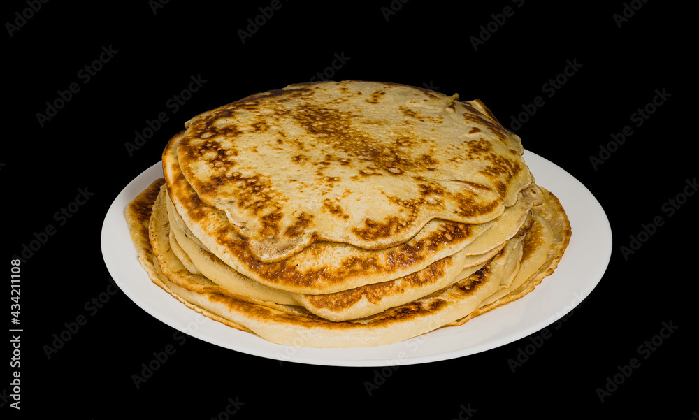 pancakes on a plate on a black background