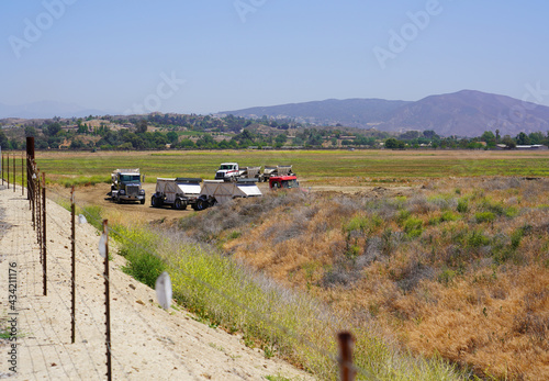 Construction  for Homes taking place with big semi trucks  photo