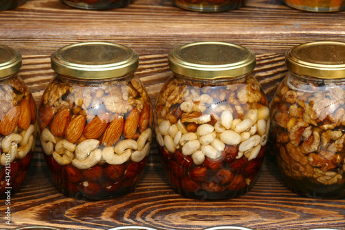 Nut set. Canned nuts in glass jars. Stock of vitamins. Hand it over yourself, home preservation. Harvest of nuts. Healthy food. Delicacy.