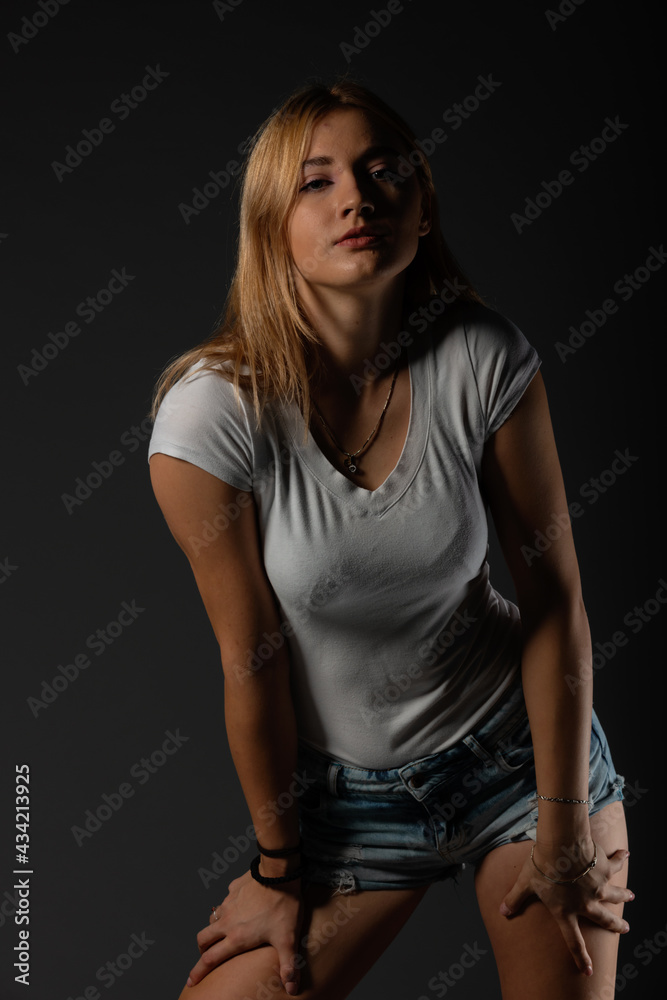 Attractive blonde in a casual urban clothes. Portrait. Isolated. Attractive blonde in a casual urban clothes. Portrait. Isolated.
