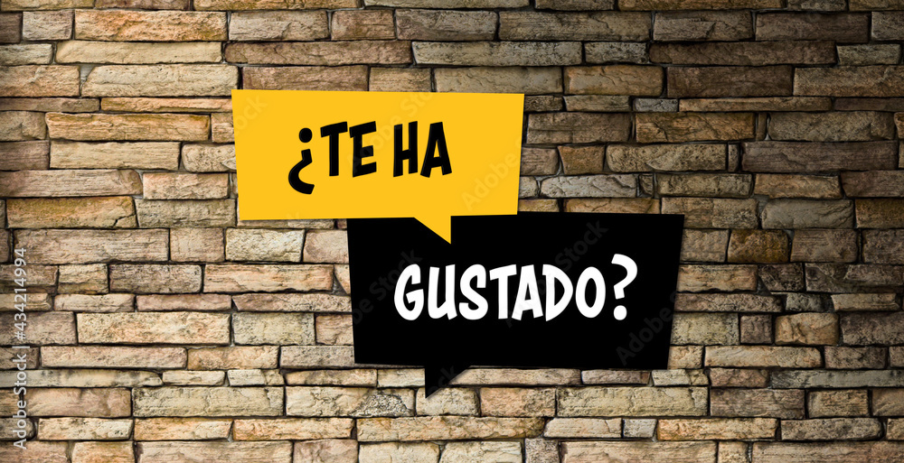 speech bubbles with Spanish message for DO YOU LIKE IT? on a brick wall background speech bubbles with Spanish message for DO YOU LIKE IT? on a brick wall background
