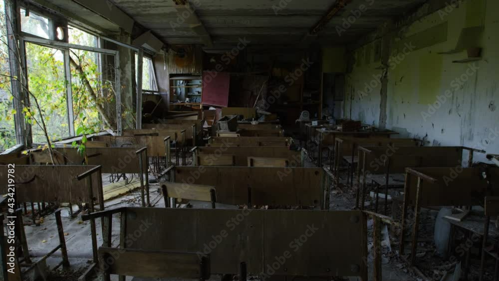 Zoom in view of abandoned classroom with furniture in Pripyat Zoom in view of abandoned classroom with furniture in Pripyat