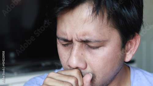 Young asian man have cough and wearing face mask, Health care concept, man is sick