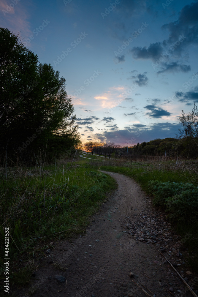 late sunset on a mountain bike trail in the city late sunset on a mountain bike trail in the city