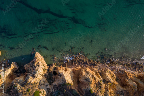 Canavial Beach. Portuguese southern golden coast cliffs. Aerial drone top view in Lagos in Algarve, Portugal.