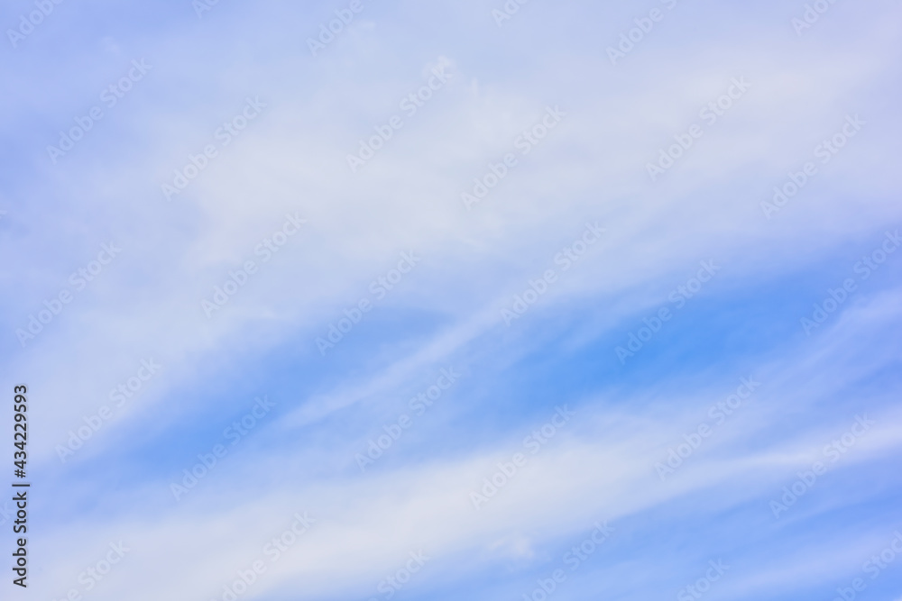 Hazy small cirrostratus, cirrocumulus and cumulus cloud formations on a sunny afternoon in late summer are contrasted against the blue sky. Hazy small cirrostratus, cirrocumulus and cumulus cloud formations on a sunny afternoon in late summer are contrasted against the blue sky.
