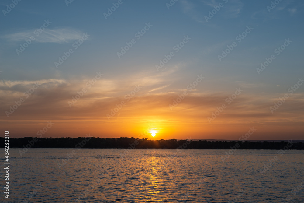 Sunset sun across the river