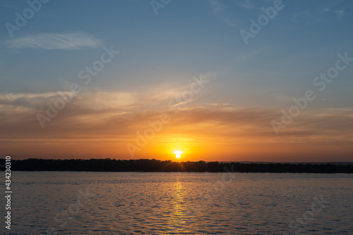 Sunset sun across the river © liper06