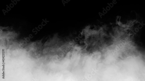 White smoke or fog isolated on black background photo