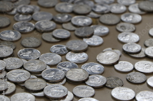 a pile of coins scattered on the floor