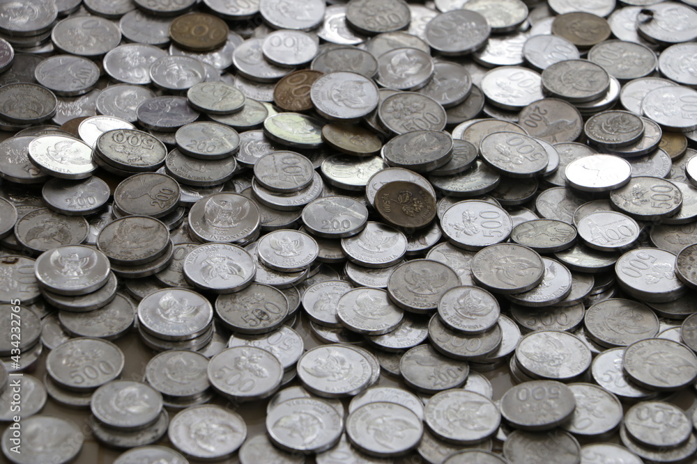 a pile of coins scattered on the floor a pile of coins scattered on the floor