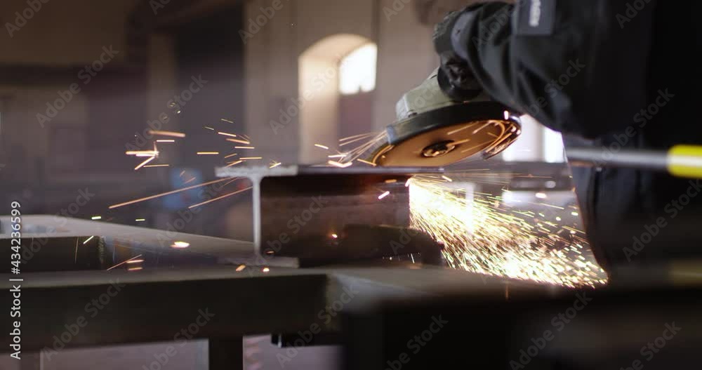 Spark from angle grinder flying into camera, danger and safety at work