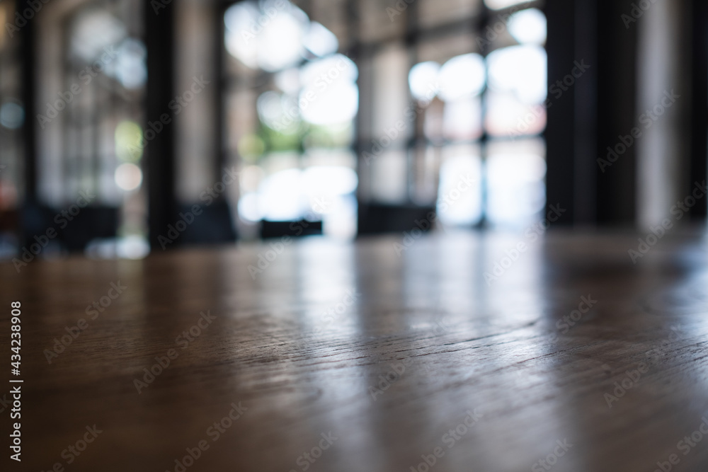 Wooden table top with blurred background in cafe - obrazy, fototapety, plakaty 