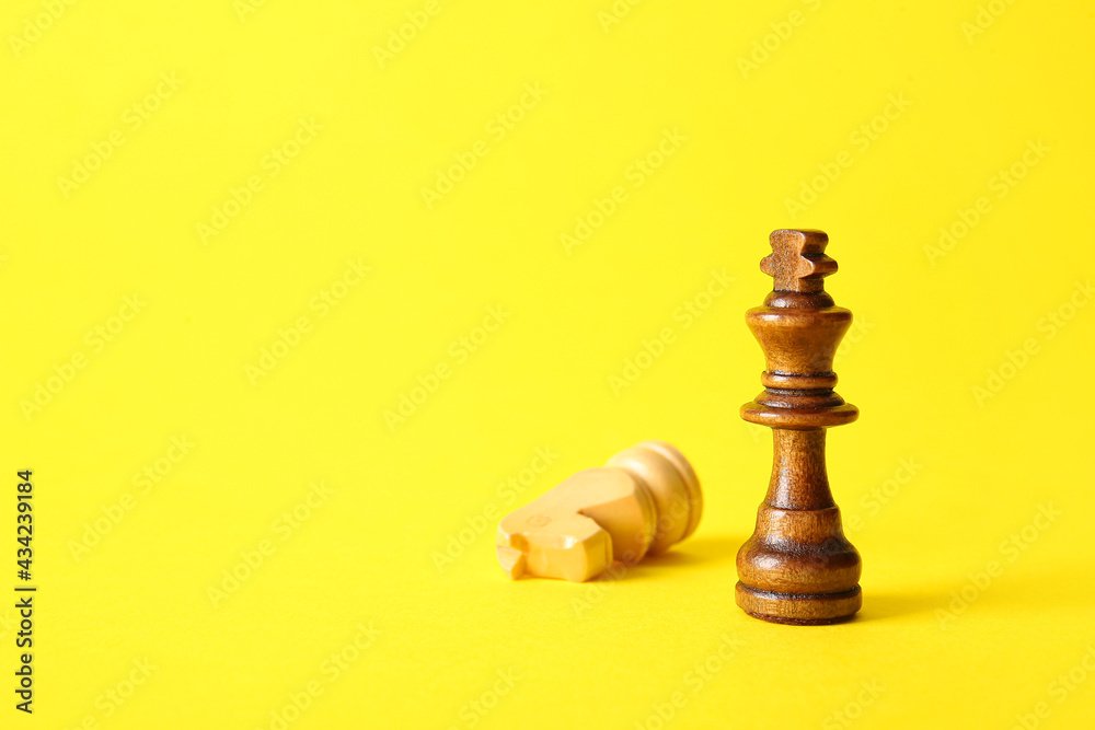 Wooden king and knight on color background Wooden king and knight on color background