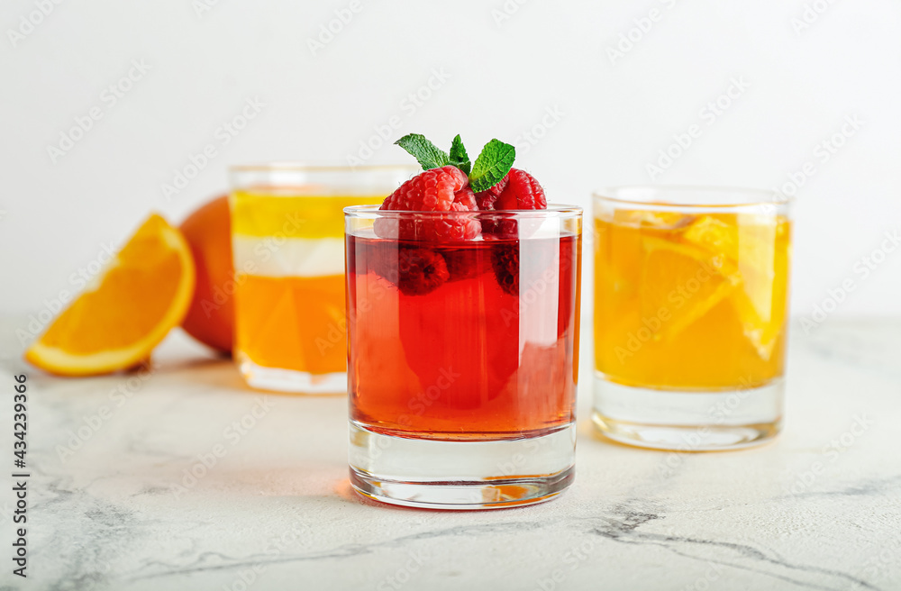 Glasses of tasty jelly on light background Glasses of tasty jelly on light background