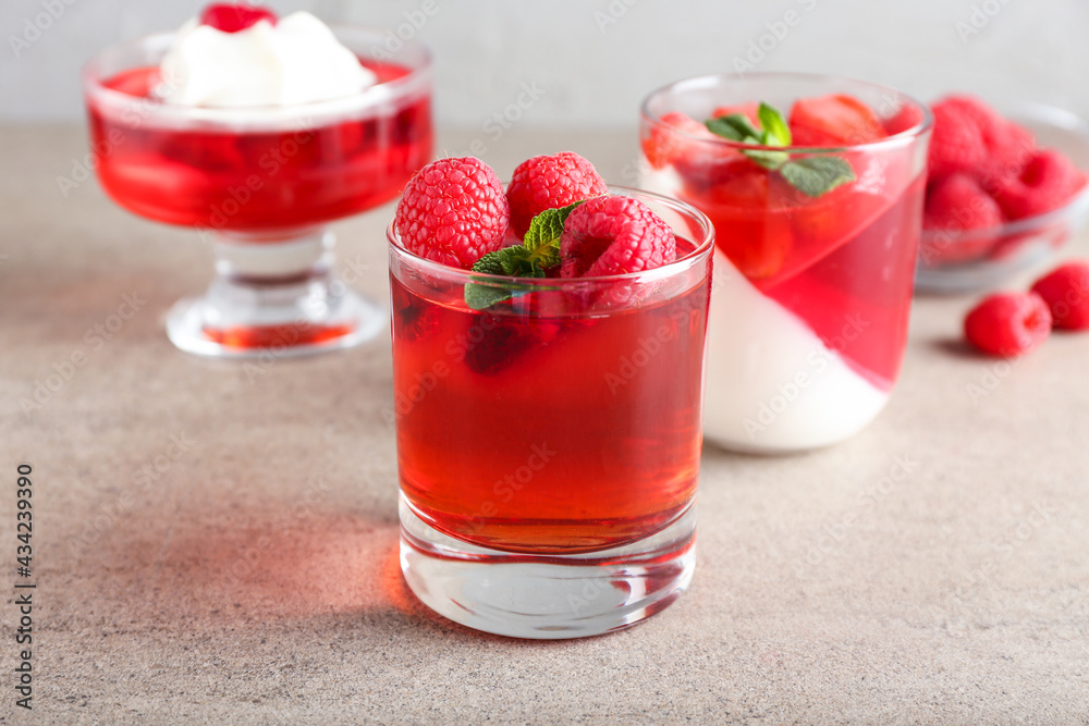 Glasses of tasty jelly on grey background Glasses of tasty jelly on grey background