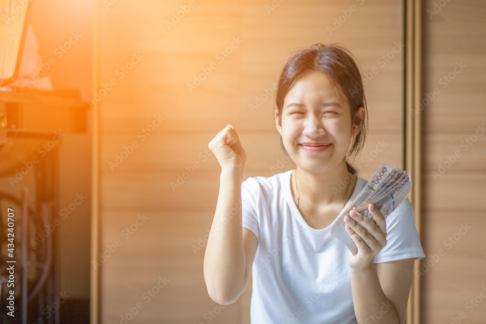 Girl hand holding banknotes Concept of saving money for education. Girl hand holding banknotes Concept of saving money for education.