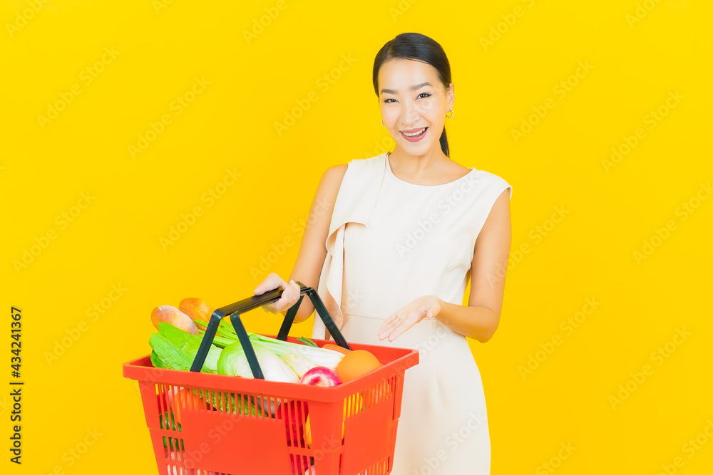 Portrait beautiful young asian woman smile with grocery basket Portrait beautiful young asian woman smile with grocery basket