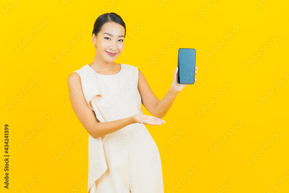 Portrait beautiful young asian woman smile with smart mobile phone Portrait beautiful young asian woman smile with smart mobile phone