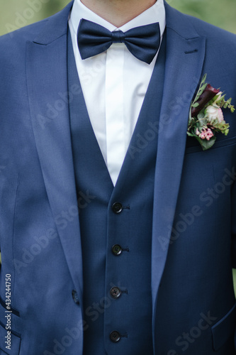 Groom wearing a bow tie close up