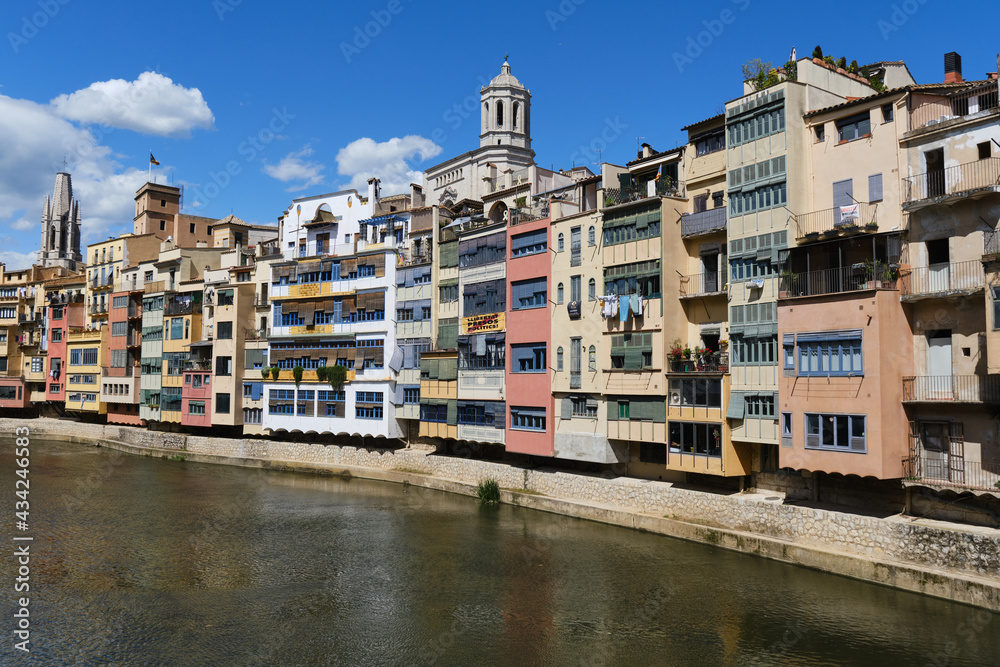 colorful houses on the river onyar passing through the old town of girona, catalunya, spain
