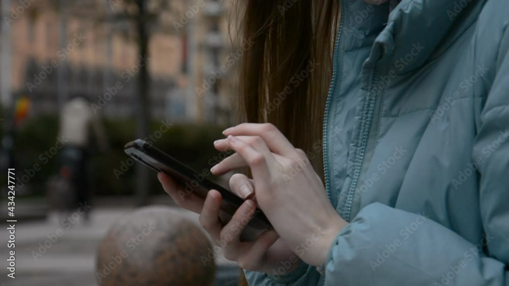 close-up young businesswoman typing smartphone close-up young businesswoman typing smartphone