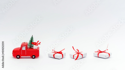 Toy car with christmas tree and gifts © frimufilms