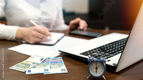 Woman working with finances on the table