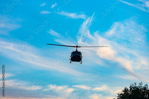 Helicopter providing air support during a Civil Police operation to combat organized crime, and drug trafficking, in a community (favela) in Rio de Janeiro, Brazil
