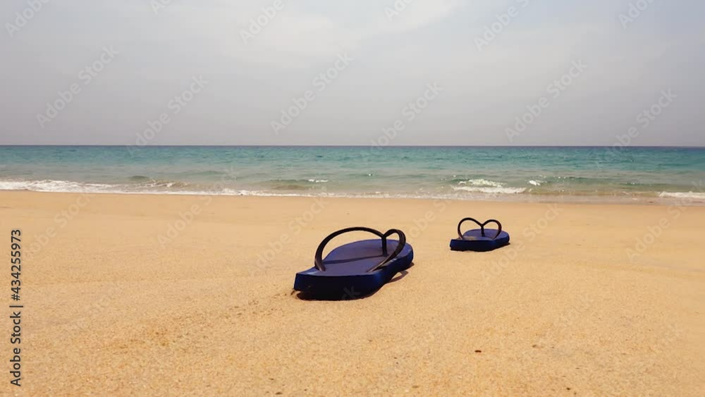 blue sandal at the sandy beach with sky bright sun, the environment around blue seawater. landscape nature background. b roll footage color of day sky. Panoramic sea view in tropical sea tourism. blue sandal at the sandy beach with sky bright sun, the environment around blue seawater. landscape nature background. b roll footage color of day sky. Panoramic sea view in tropical sea tourism.