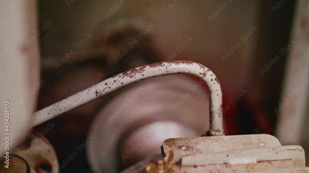 Output shaft of tug engine is going round. Focused foreground and unfocused background.