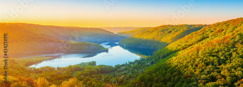 Vivid sunrise landscape in the national nature park Podilski Tovtry, canyon and Studenytsia river is tributary of Dnister river, view from above