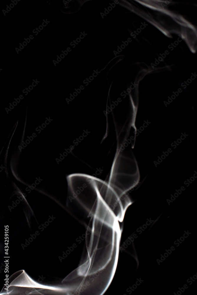 cloud of white smoke on black background