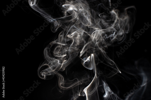 cloud of white smoke on black background