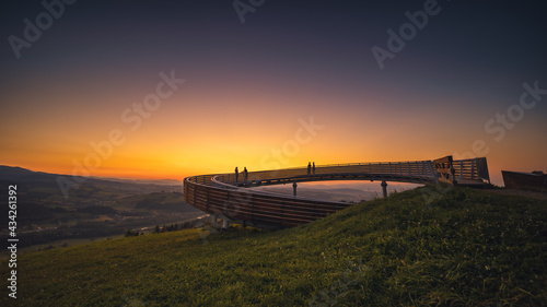 Picturesque sunset in Beskid Sądecki seen from the tower in Wola Krogulecka, with views of the mountains and fields.