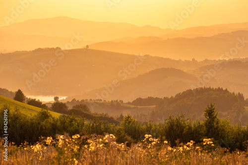 A warm summer sunset in the Rożnowskie Foothills, near Nowy Sącz. Poland, Lesser Poland Voivodeship. photo