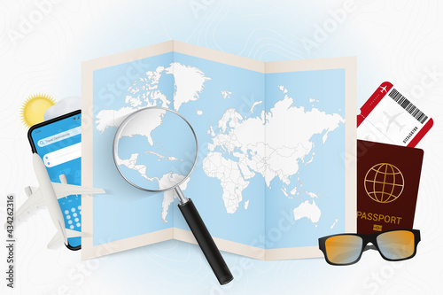 Travel destination Cuba, tourism mockup with travel equipment and world map with magnifying glass on a Cuba.