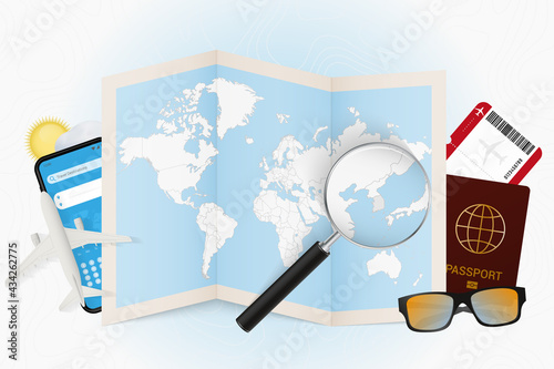 Travel destination South Korea, tourism mockup with travel equipment and world map with magnifying glass on a South Korea.