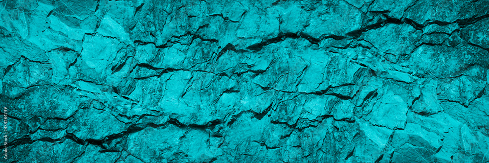 Obraz premium Turquoise background. Toned rock texture. Beautiful background with copy space for design. Wide banner.