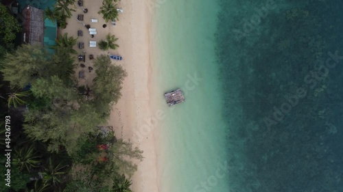 Woman lying on a raft at Koh Wai, Trat, Thailand.