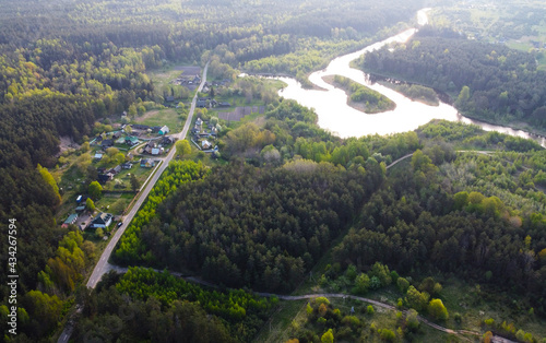 A view from a height of a summer sunset on the river