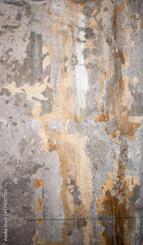 Scratched, cracked, flooded and bruised wall in an old industrial room (basement or warehouse). Industrial, texture or wallpaper background with brick and stains