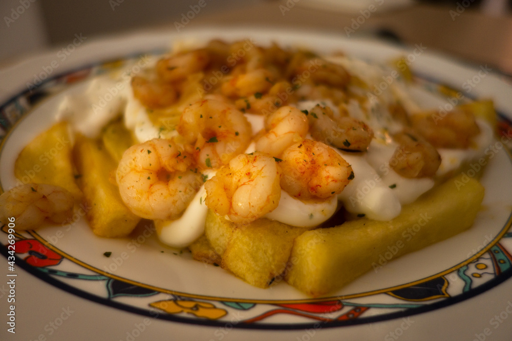Spanish tapas of potatoes with shrimp and aioli. Mediterranean food Spanish tapas of potatoes with shrimp and aioli. Mediterranean food